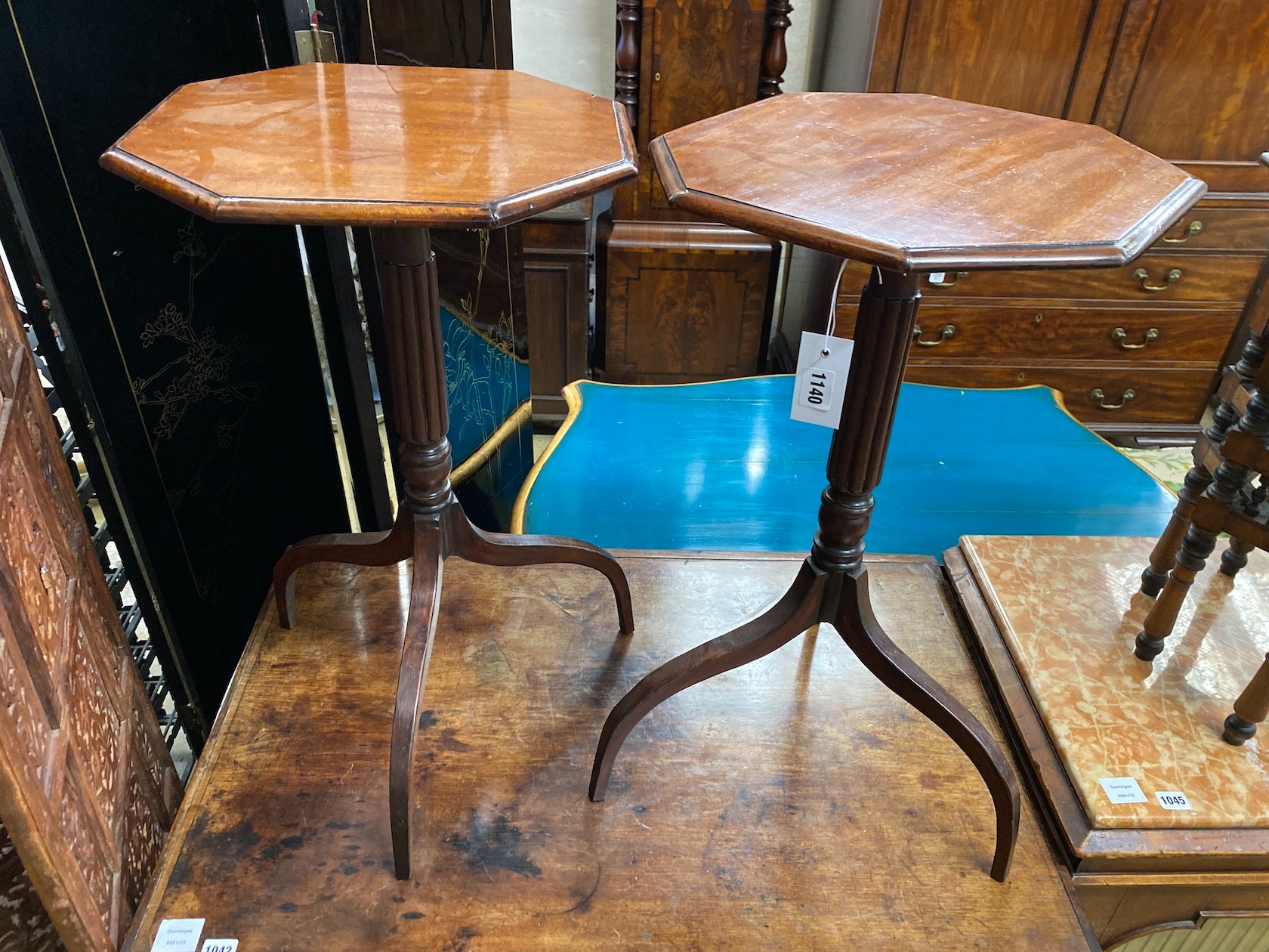 A pair of Regency style octagonal mahogany wine tables, width 40cm, height 70cm